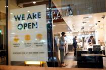 A sign advertises a restaurant opening Tuesday, March 16, 2021, in Santa Monica, Calif. (AP Pho ...