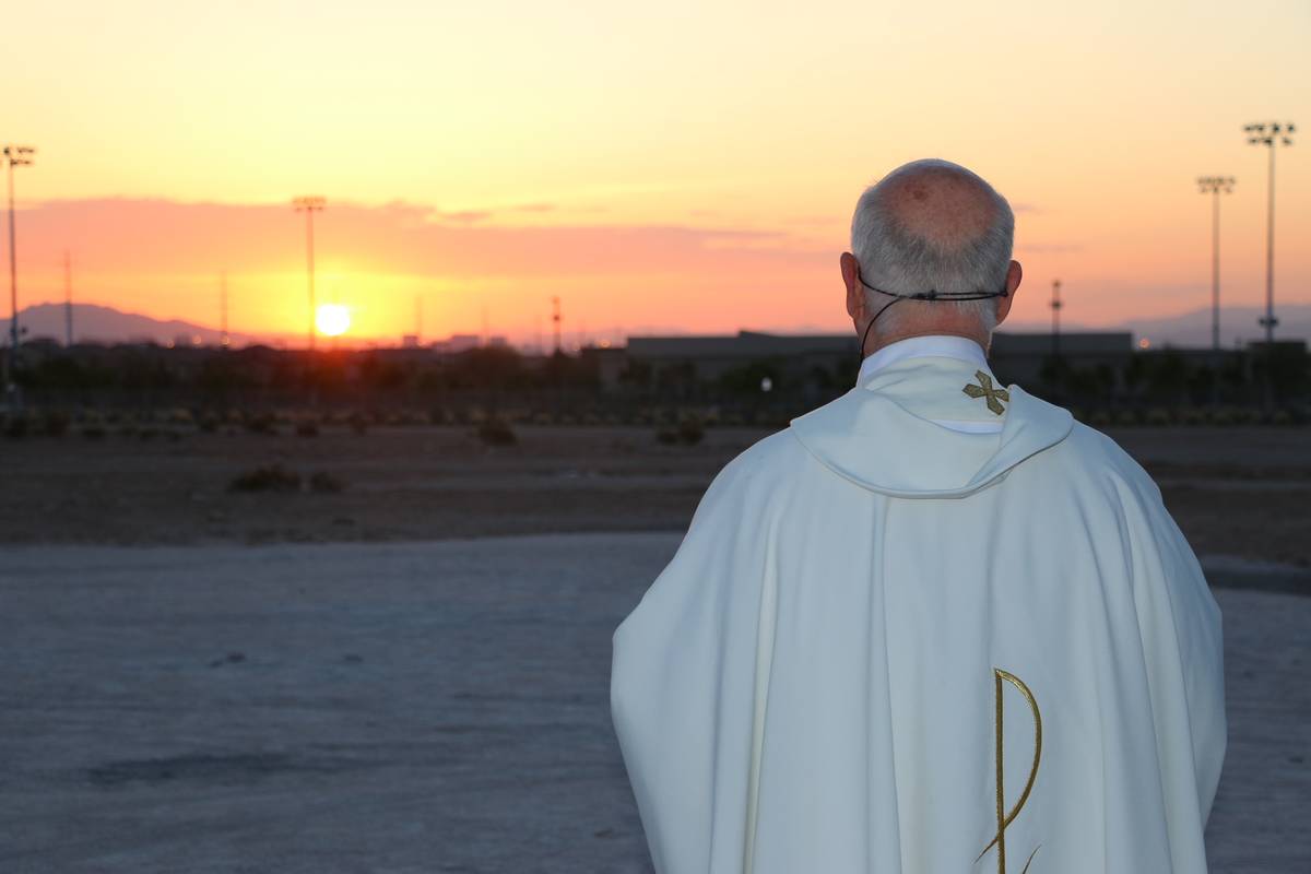 The Rev. William Kenny and parishioners attending a previous year's Easter sunrise Mass at Holy ...
