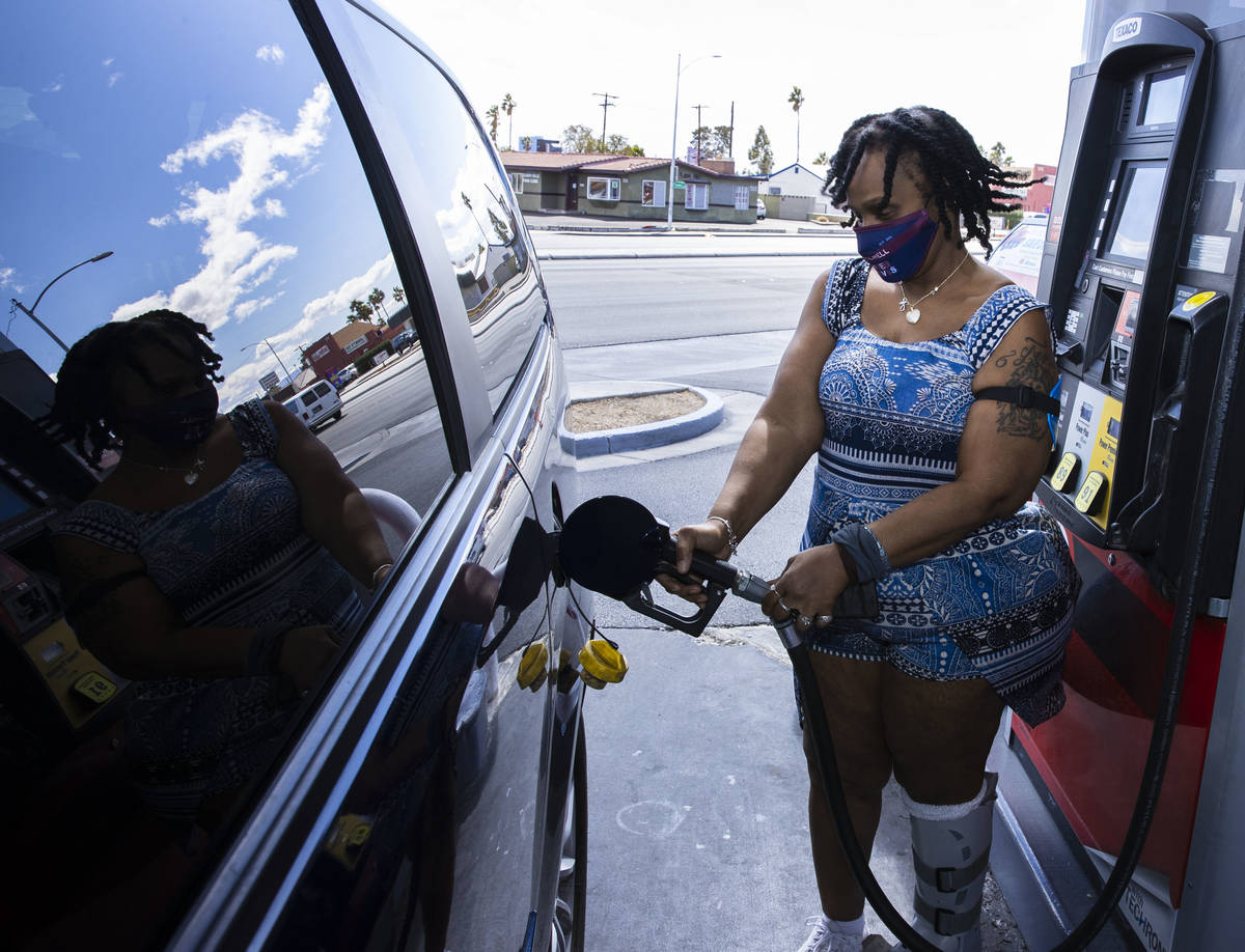 Rosalyn Thomas pumps gas at Texaco gas station, on Decatur Avenue, on Monday, March, 15, 2021, ...
