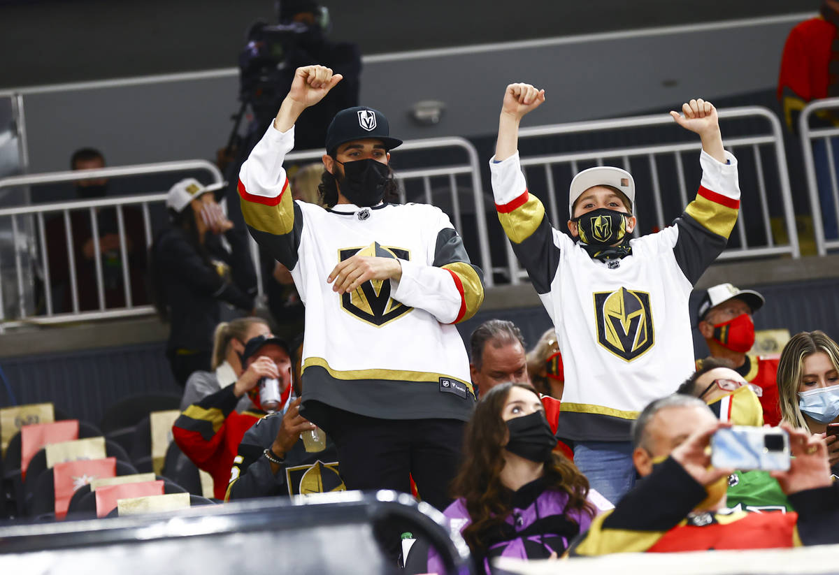 Golden Knights fans cheer before the start of an NHL hockey game against the San Jose Sharks at ...