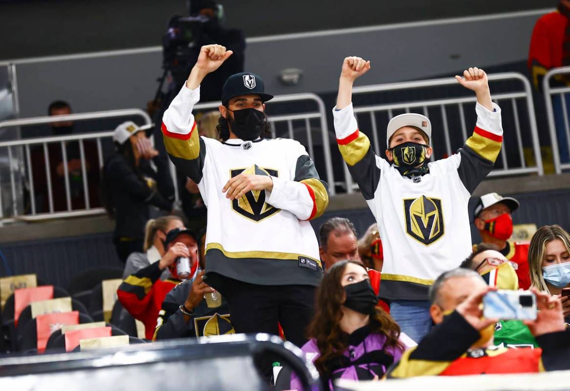 Golden Knights fans cheer before the start of an NHL hockey game against the San Jose Sharks at ...