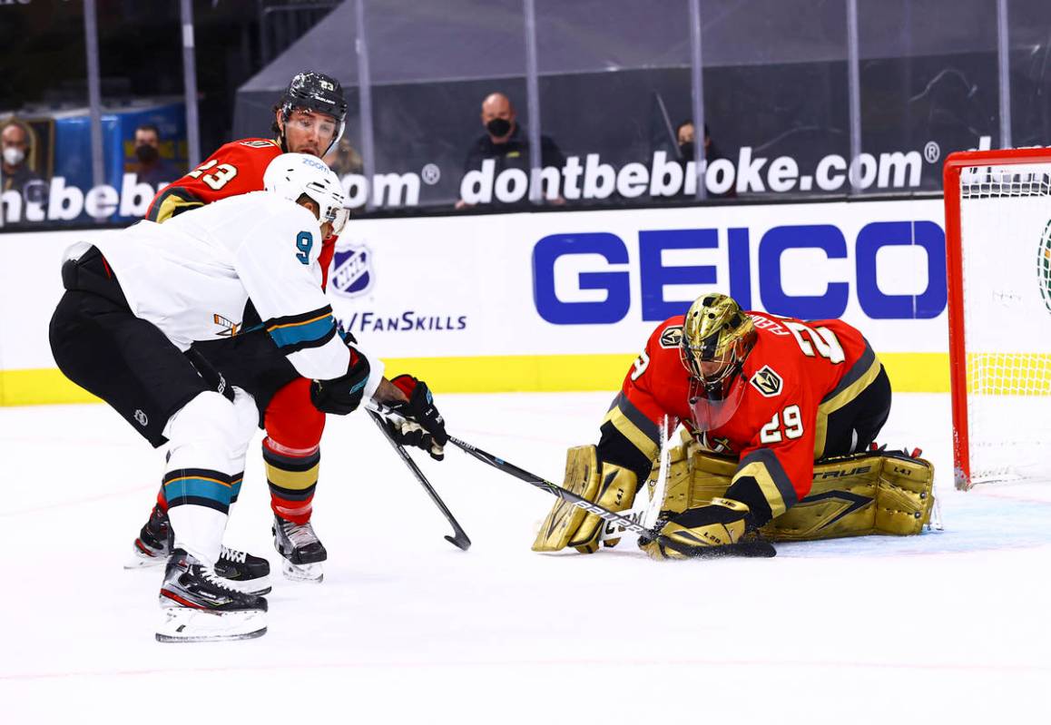 Golden Knights goaltender Marc-Andre Fleury (29) stops the puck in front of San Jose Sharks' Ev ...