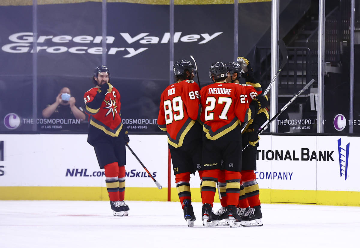 The Golden Knights celebrate after a goal by Max Pacioretty, right, during the first period of ...