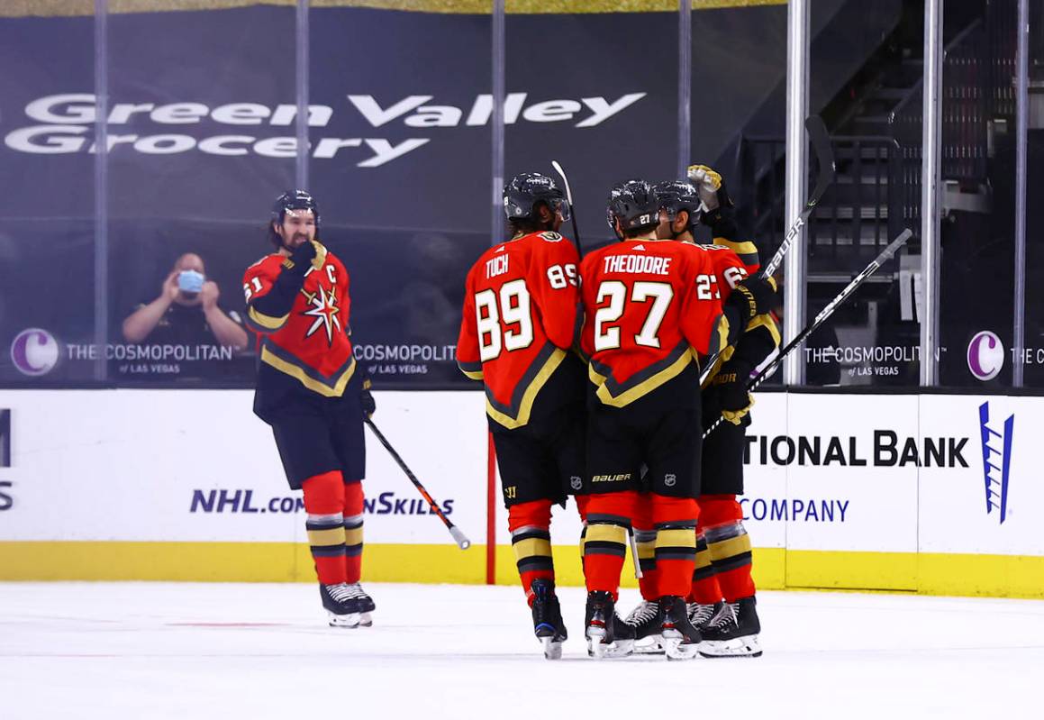 The Golden Knights celebrate after a goal by Max Pacioretty, right, during the first period of ...