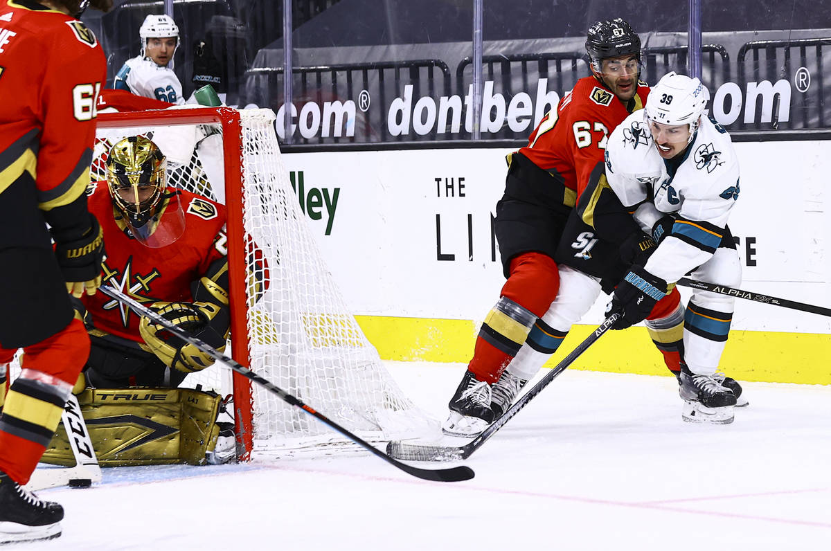 San Jose Sharks' Logan Couture (39) takes a shot against Golden Knights goaltender Marc-Andre F ...