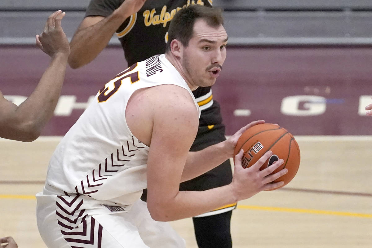 Loyola Chicago's Cameron Krutwig looks to pass during the second half of an NCAA college basket ...