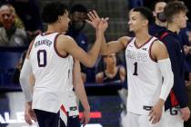 Gonzaga guard Julian Strawther (0) greets guard Jalen Suggs (1) during introductions before the ...