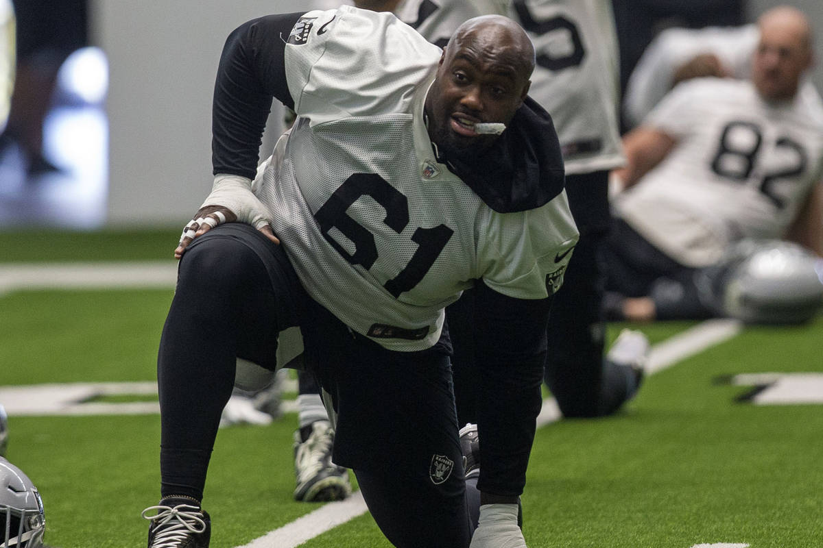 Las Vegas Raiders center Rodney Hudson (61) stretches during a practice session at the Intermou ...