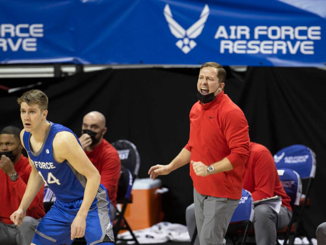 UNLV Rebels head coach T.J. Otzelberger, right, calls a defensive play in the first half during ...