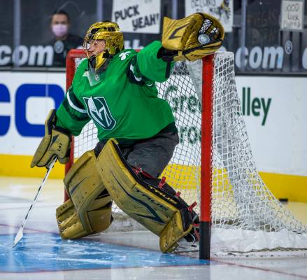 Golden Knights goaltender Marc-Andre Fleury (29) makes a stop during the warm ups before an NHL ...