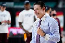 Iona head coach Rick Pitino celebrates after Iona won an NCAA college basketball game against F ...