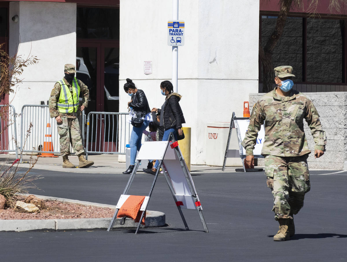 People arrive at a COVID-19 testing center at the Stan Fulton Building, on Wednesday, March 17, ...