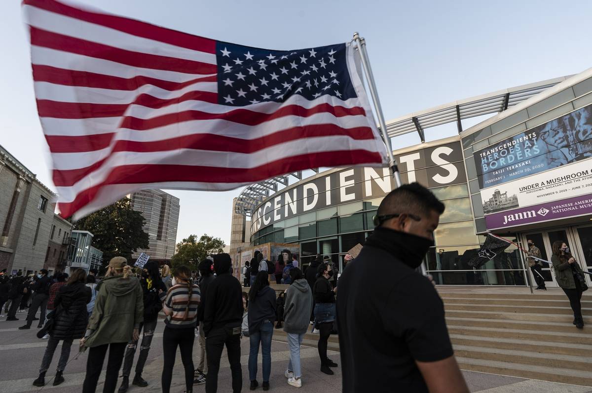 Demonstrators participate at a rally "Love Our Communities: Build Collective Power" to raise aw ...