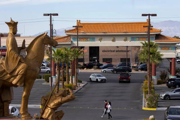 Pedestrians cross the parking lot at Chinatown Plaza on Wednesday, March 17, 2021, in Las Vegas ...