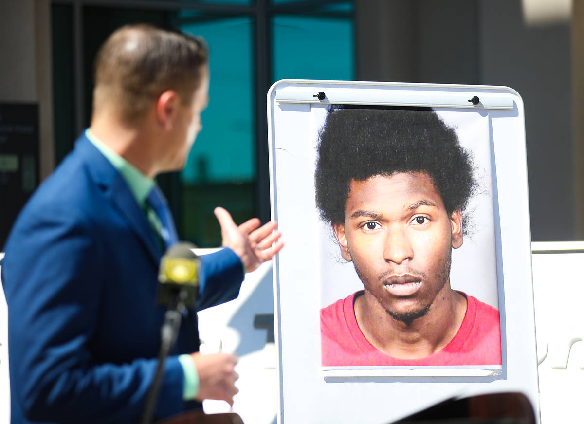 Sex Crimes Lieutenant Richard Meyers addresses the media next to a photo of Laparese Jones, the ...