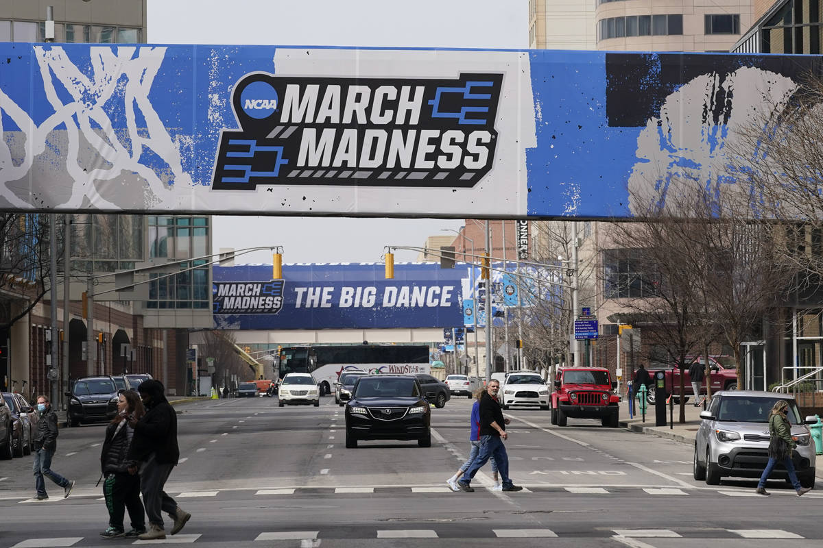 March Madness banners for the NCAA college basketball tournament cover crosswalks in downtown I ...