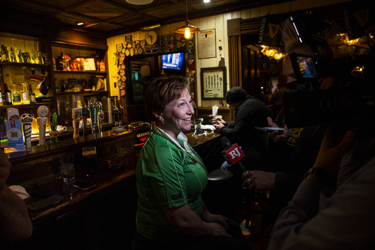 Kim McFarland, of Las Vegas, speaks about visiting Ri Ra Irish Pub as people gather to celebrat ...