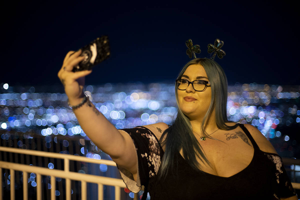Alexa Herrera, of Las Vegas, takes a selfie on St. Patrick's Day, and her birthday, at The STRA ...
