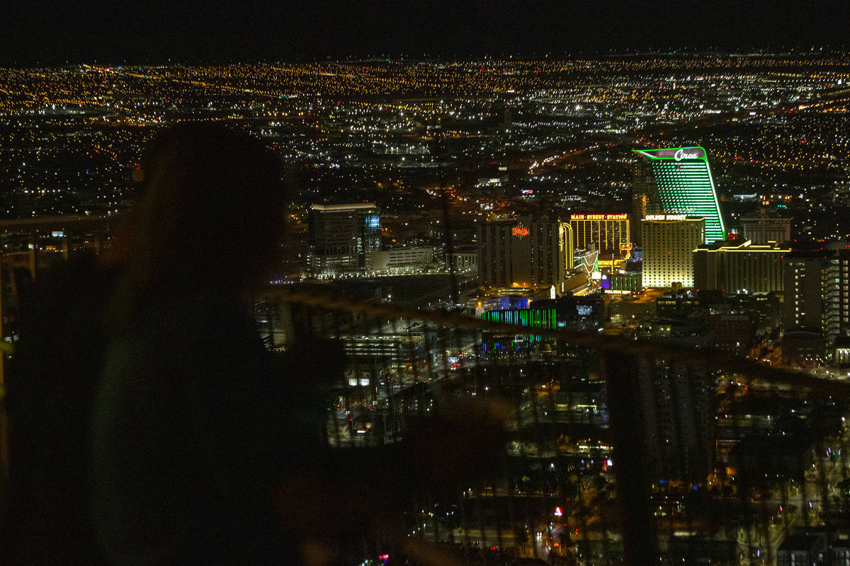 Visitors to The STRAT view the Las Vegas Valley, including Circa which is lit green for St. Pat ...