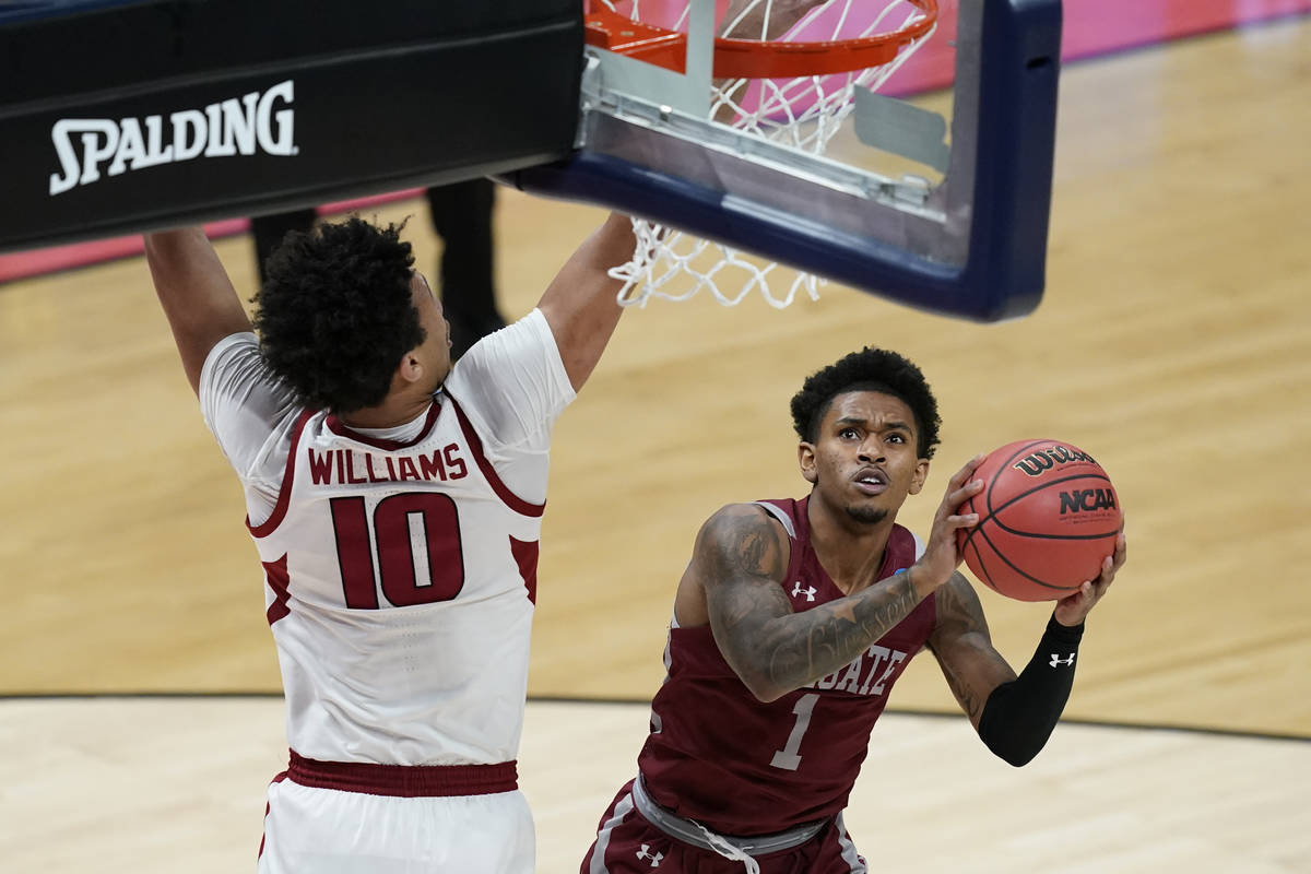 Colgate's Jordan Burns (1) puts up a shot against Arkansas's Jaylin Williams (10) during the fi ...