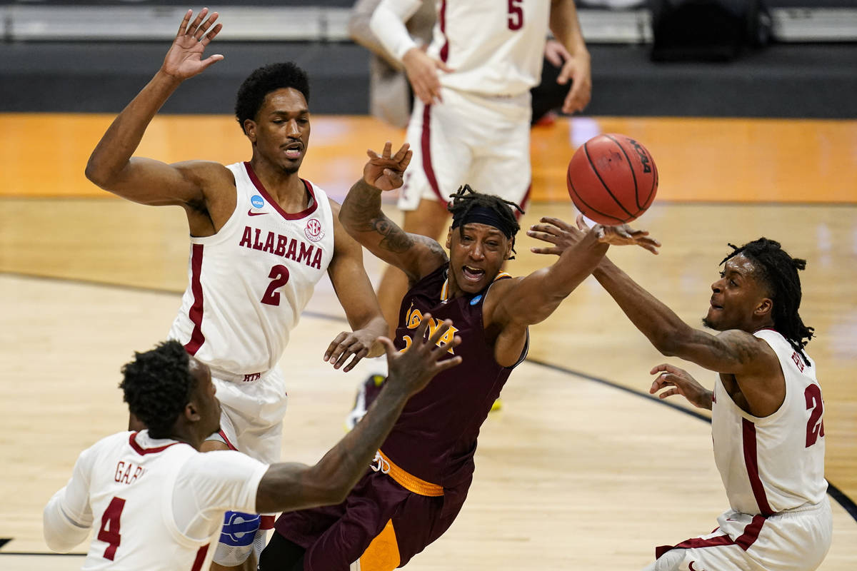 Alabama's Juwan Gary (4), Jordan Bruner (2) and John Petty Jr. (23) force a turn over by Iona g ...