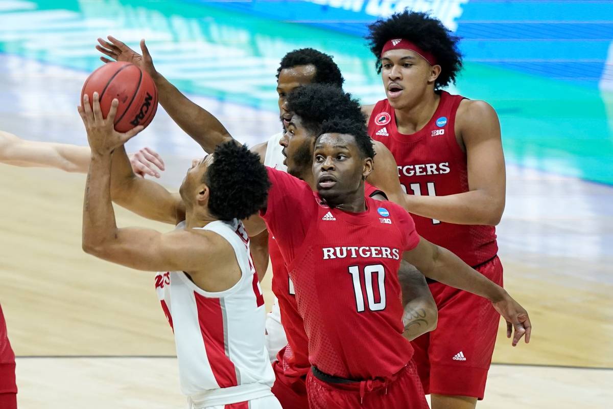 Rutgers' Montez Mathis (10) defends against Houston's Quentin Grimes, left, during the first ha ...