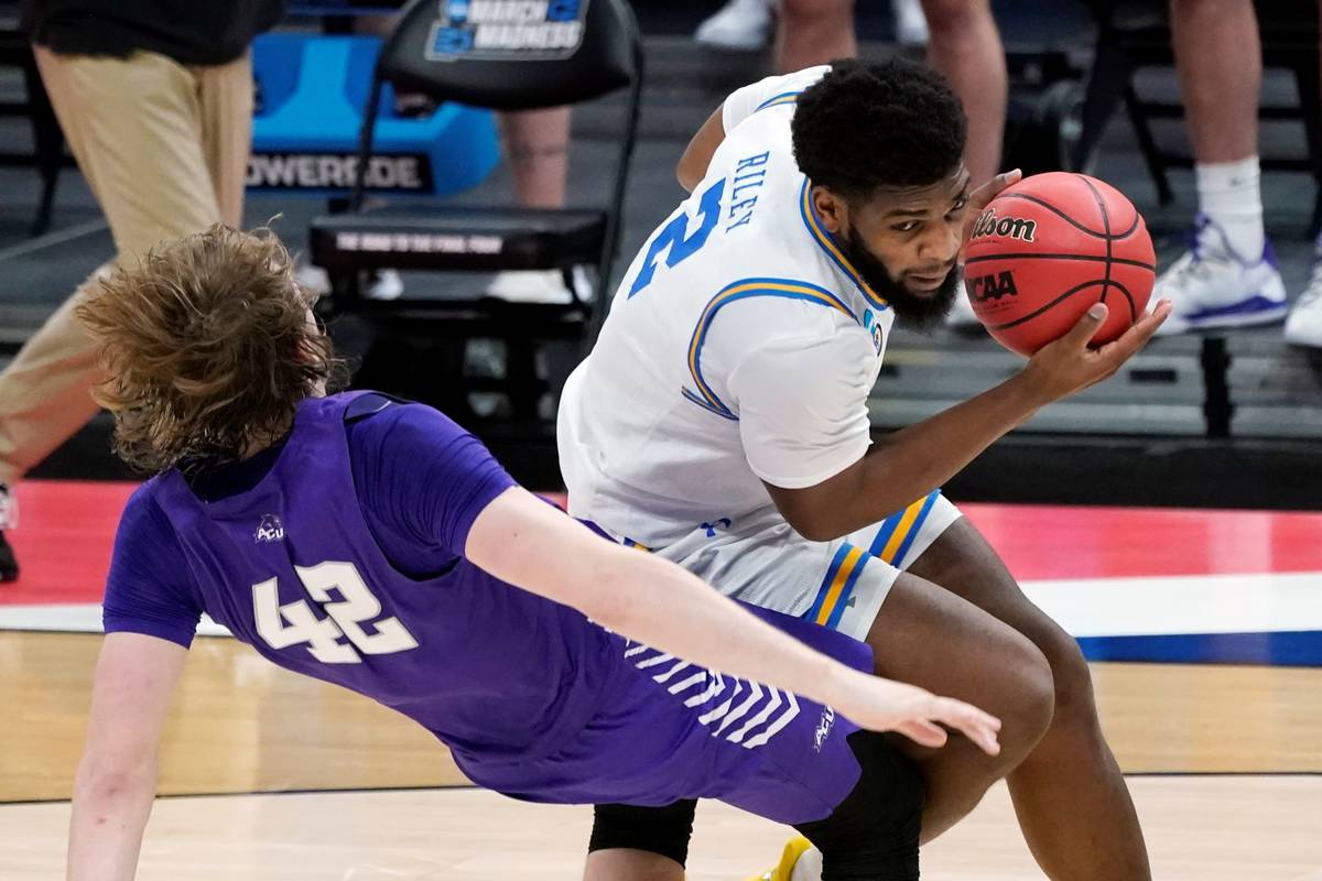 UCLA's Cody Riley (2) collides with Abilene Christian's Clay Gayman (42) during the first half ...