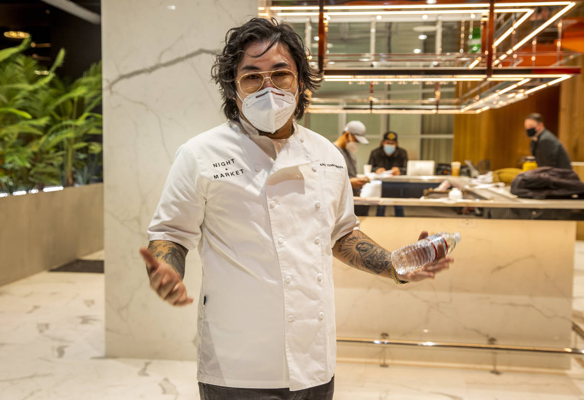 Chef Kris Yenbamroong discusses the concept of Night + Market while standing in the unfinished ...