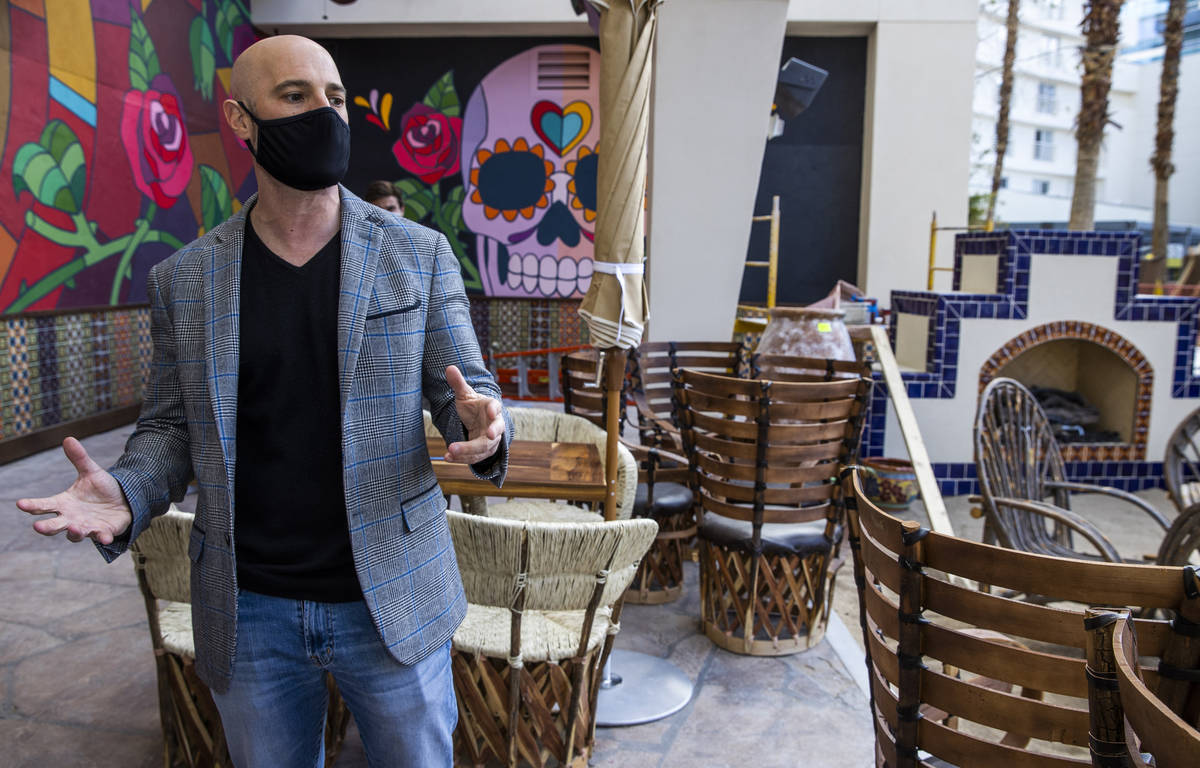 Derek Silberstein, Hakkasan Group executive vice president of food and beverage, shows a patio ...