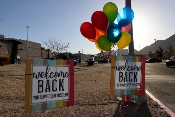 Students are welcomed for the first day of in-person education at Bailey Middle School in Las V ...