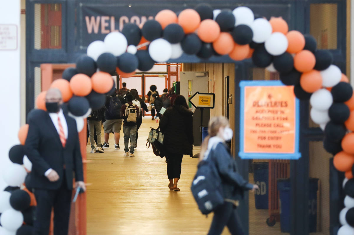 Students enter Chaparral High School in Las Vegas Monday, March 22, 2021. The next group of Cla ...