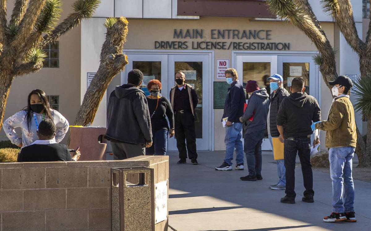 People wait outside the Nevada Department of Motor Vehicles building on West Flamingo Road in D ...