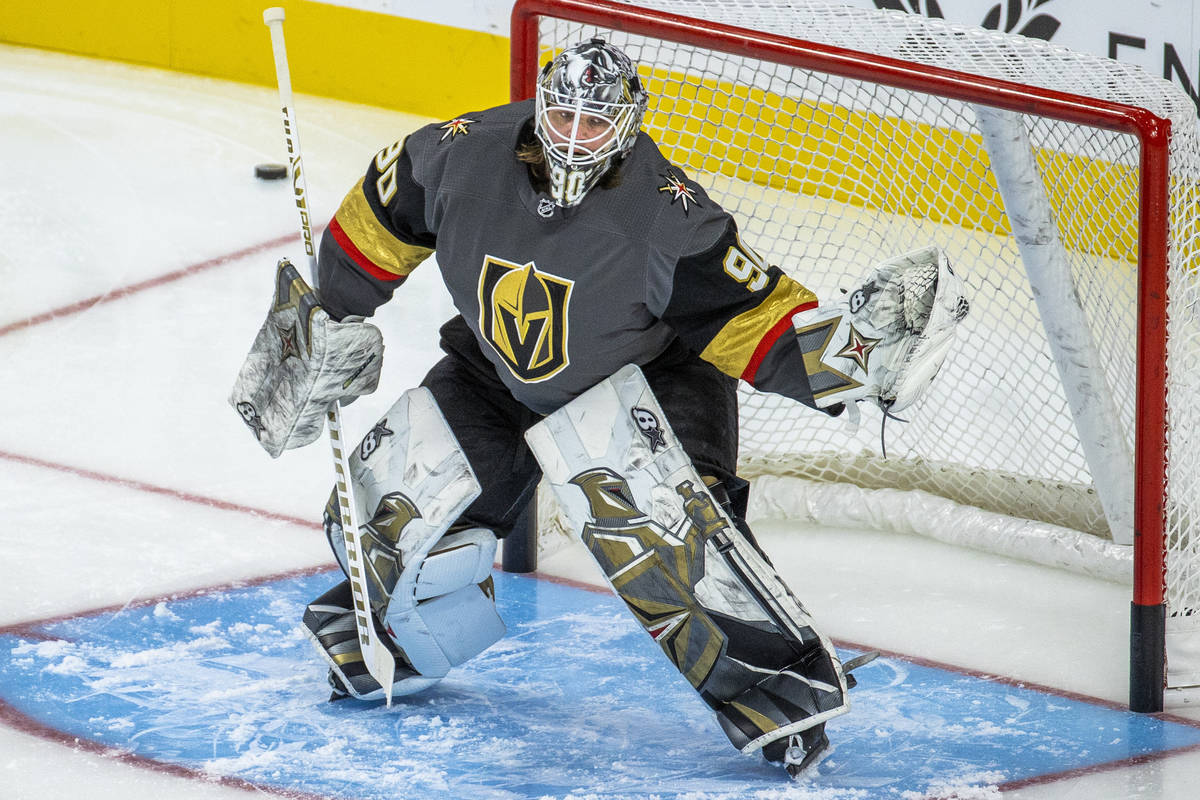 Golden Knights goaltender Robin Lehner (90) stops a puck from a teammate during the warm ups of ...