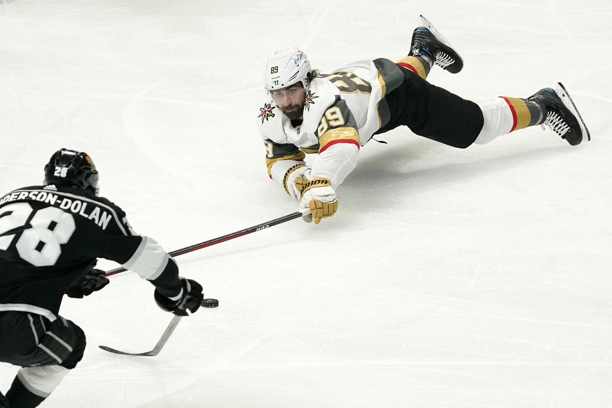 Los Angeles Kings center Jaret Anderson-Dolan, left, and Vegas Golden Knights right wing Alex T ...