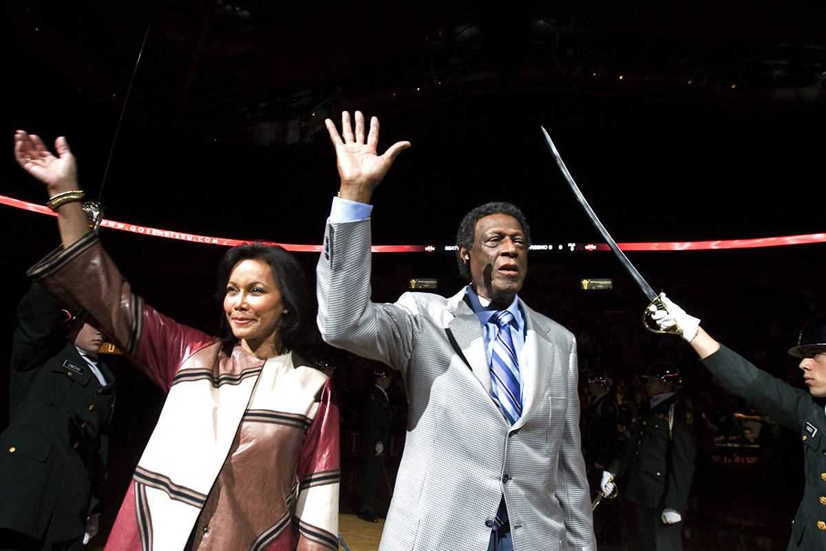 Elgin Baylor, right, and his wife, Elaine, wave to the crowd as Elgin Baylor Court was dedicate ...
