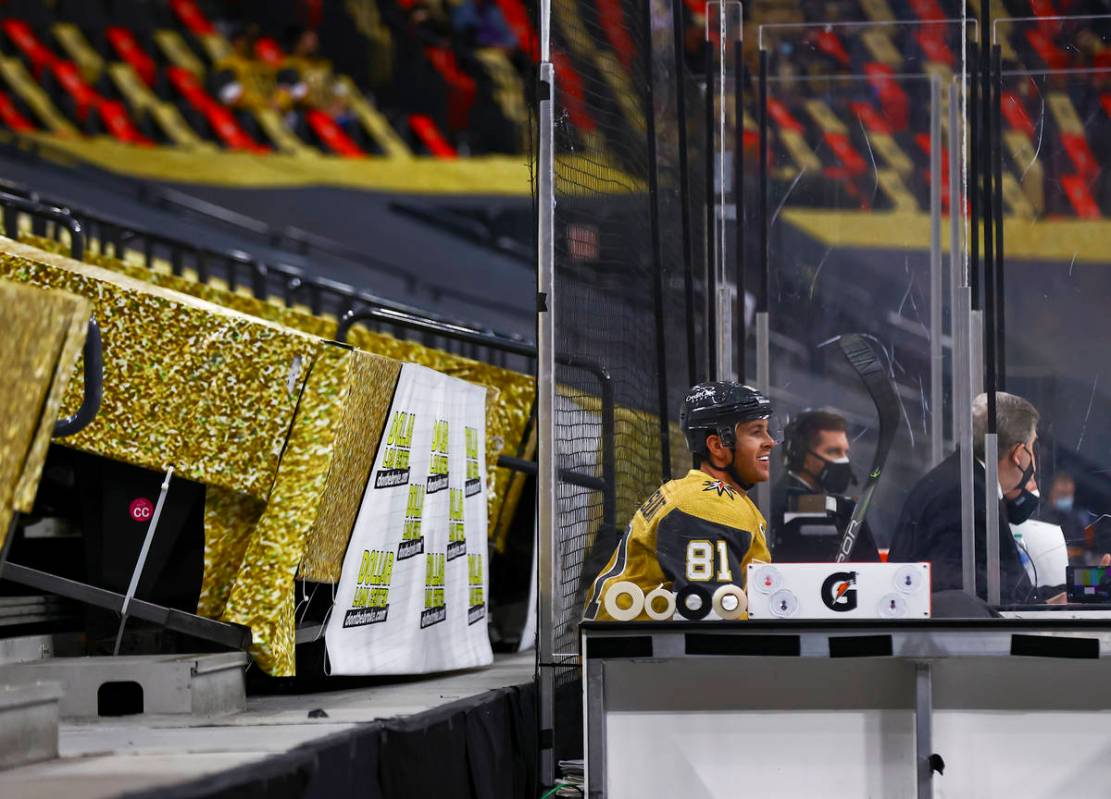 Golden Knights' Jonathan Marchessault watches the action from the penalty box during the first ...