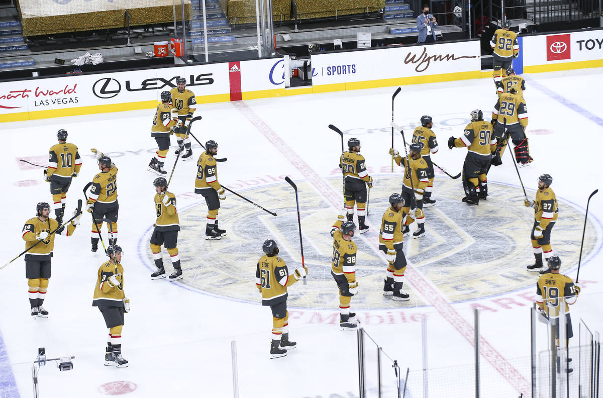 The Golden Knights celebrate after defeating the St. Louis Blues in an NHL hockey game at T-Mob ...