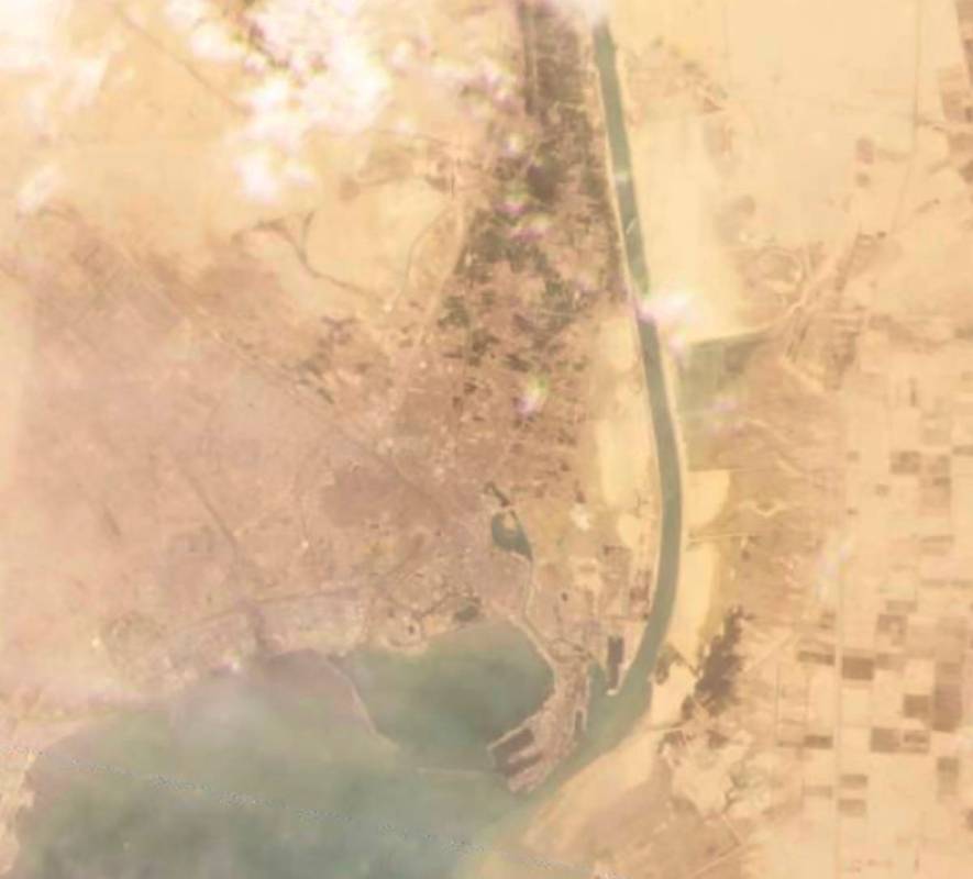 This satellite image from Planet Labs Inc. shows the cargo ship MV Ever Given stuck in the Suez ...