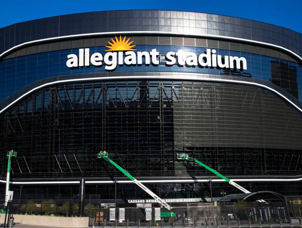 Workers removing video panels on Allegiant Stadium, on Wednesday, March 24, 2021, in Las Vegas. ...