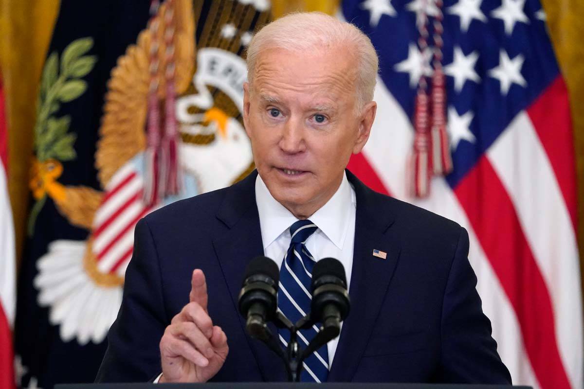 President Joe Biden speaks during a news conference in the East Room of the White House, Thursd ...