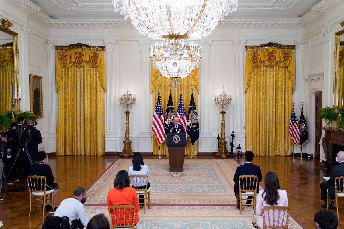 President Joe Biden speaks during a news conference in the East Room of the White House, Thursd ...