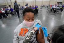 Auburn Thayer, 23, receives her Pfizer vaccination, Wednesday, March 24, 2021, in Sandy, Utah. ...