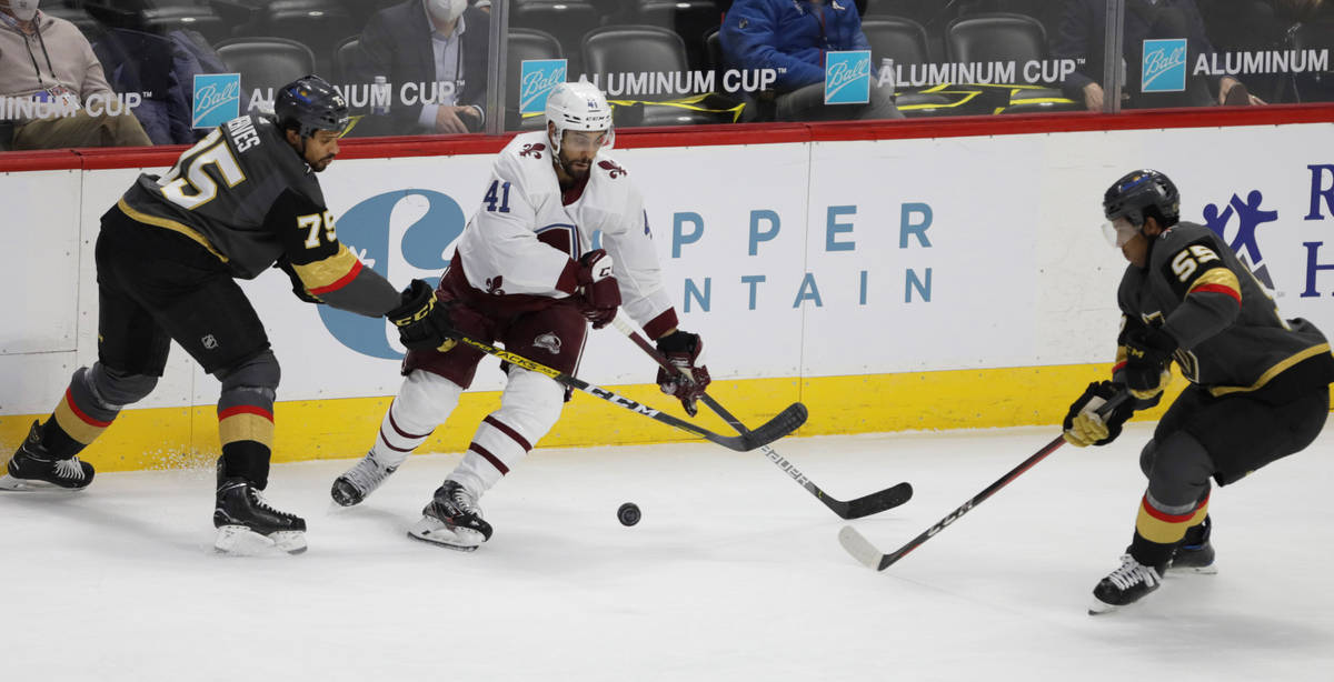 Vegas Golden Knights right wing Ryan Reaves (75) stick-checks Colorado Avalanche center Pierre- ...