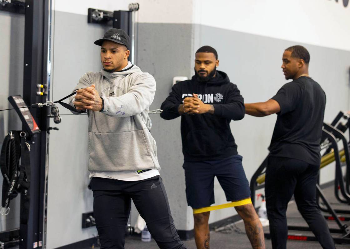 Las Vegas Raiders safety Johnathan Abram, left, and cornerback Keisean Nixon workout with Deon ...