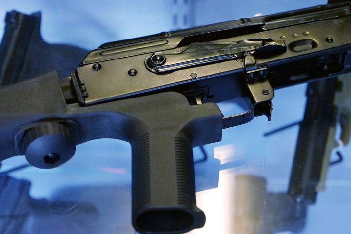 FThis Oct. 4, 2017 file photo shows a device called a "bump stock" attached to a semi-automatic ...