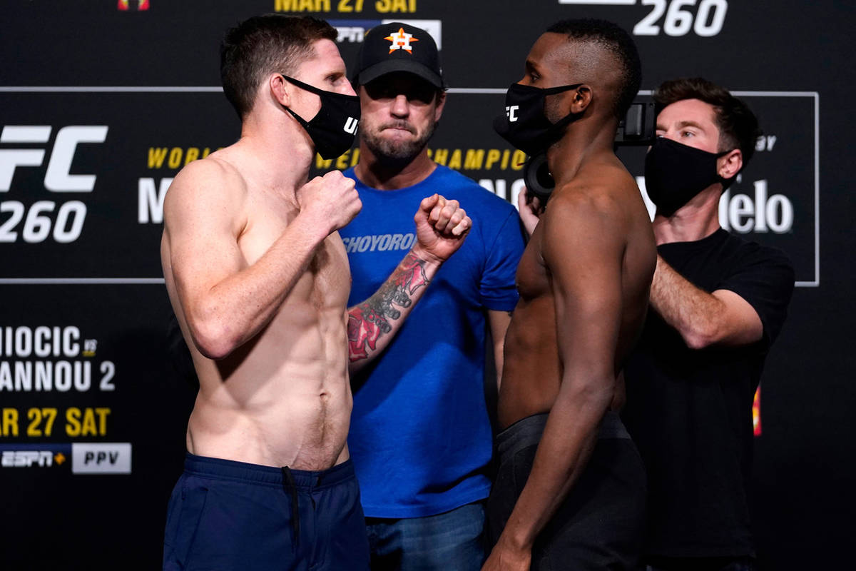 Opponents Jamie Mullarkey of Australia and Khama Worthy face off during the UFC 260 weigh-in at ...