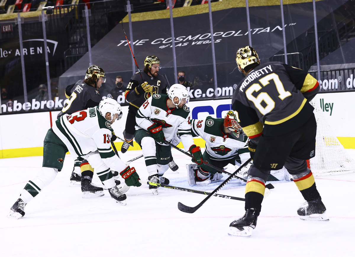 Golden Knights left wing Max Pacioretty (67) scores a goal past Minnesota Wild goaltender Cam T ...