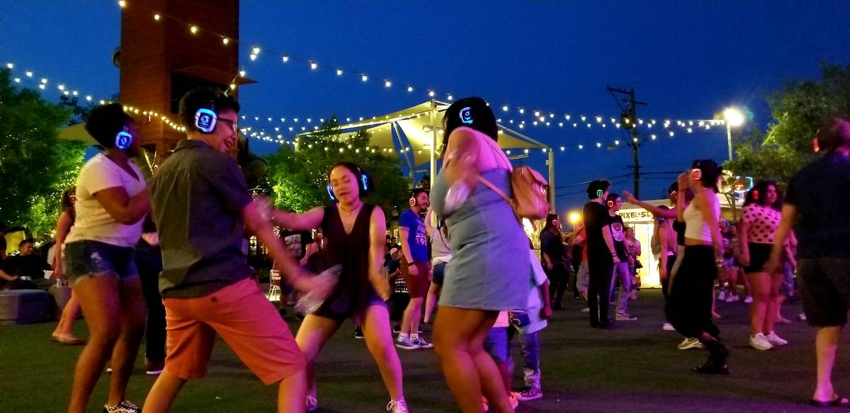 Revelers dance during a previous, pre-COVID, non-Easter edition of Silent Disco at Downtown Con ...