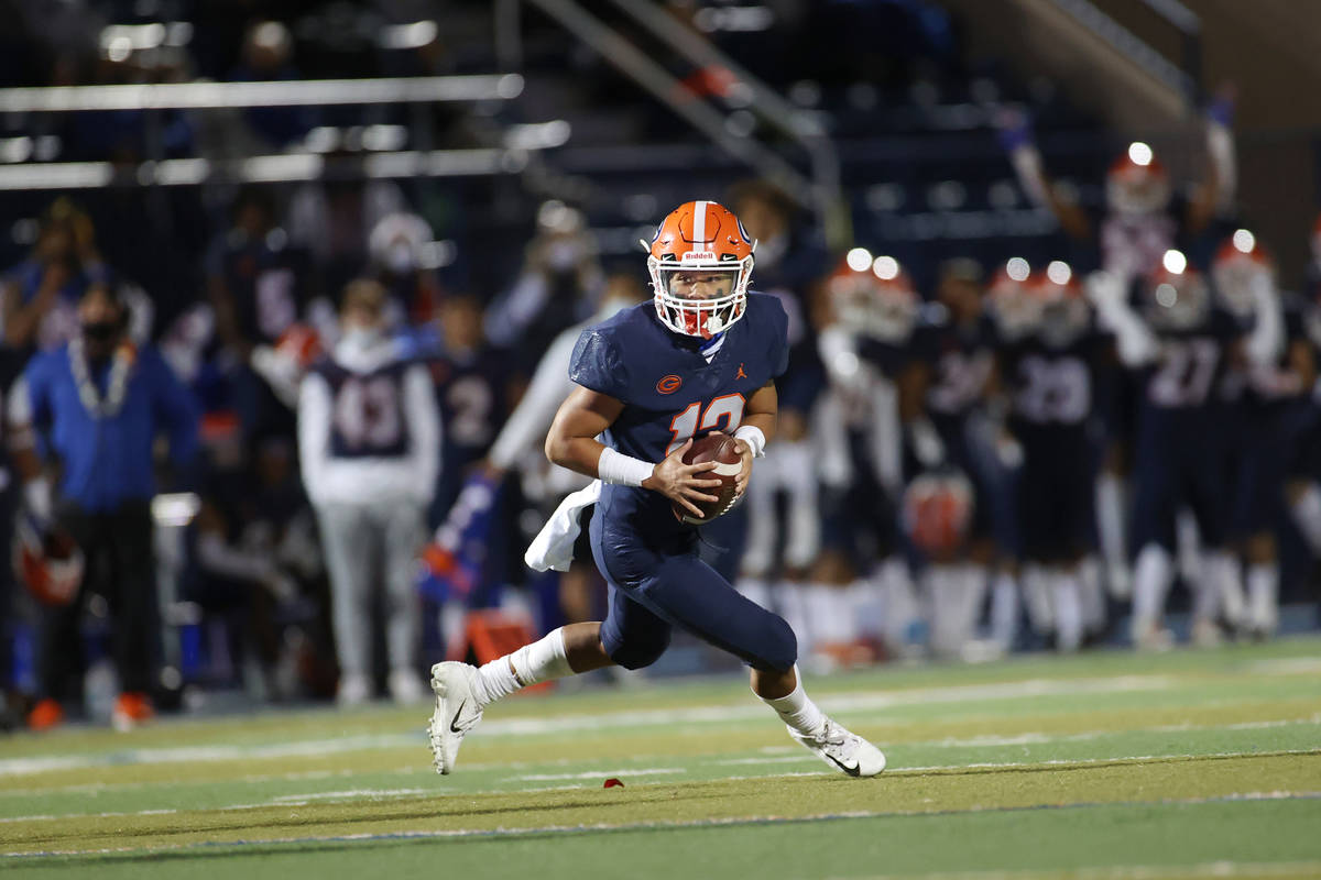 Bishop Gorman's Micah Alejado (12) looks for an open pass against Faith Lutheran during the sec ...