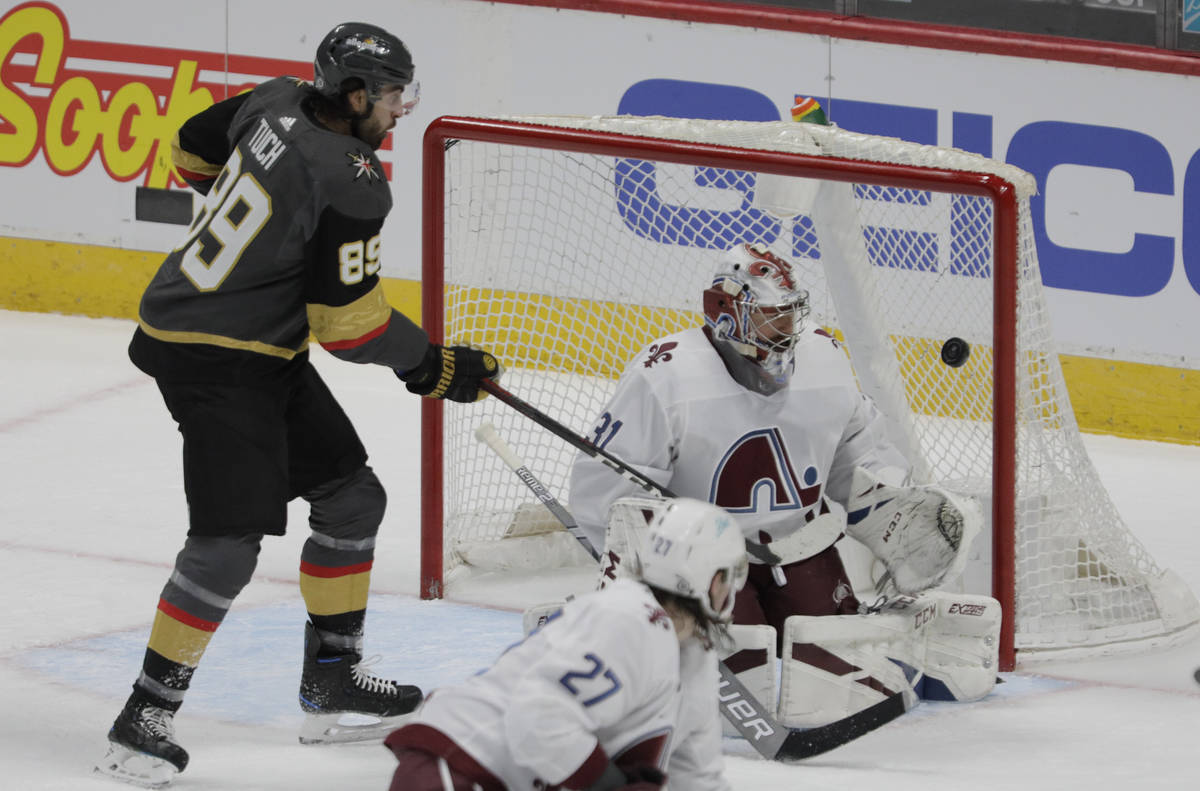 Vegas Golden Knights right wing Alex Tuch (89) watches Golden Knights defenseman Alec Martinez' ...